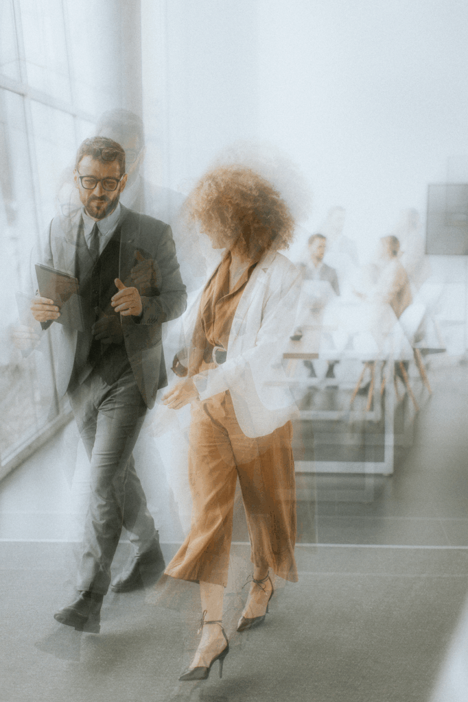 two people in business attire walking